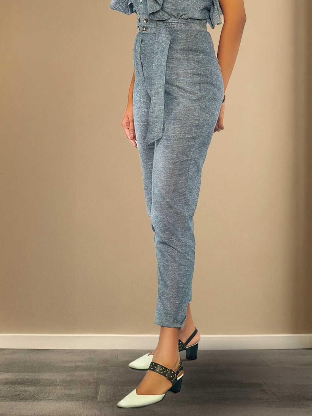 Kaia Pants – High-waisted grey hemp trousers with a structured belt and tailored fit, the Kaia Pants by Jhultaru offer timeless silhouette and strength. Made from 100% hemp – eco-friendly, durable, and naturally breathable.