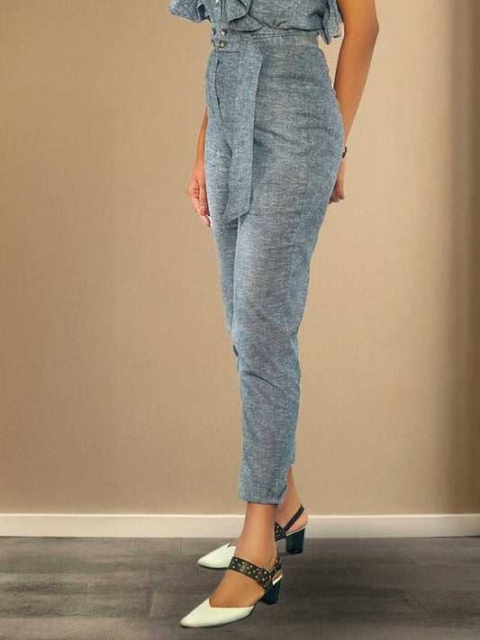 Kaia Pants – High-waisted grey hemp trousers with a structured belt and tailored fit, the Kaia Pants by Jhultaru offer timeless silhouette and strength. Made from 100% hemp – eco-friendly, durable, and naturally breathable.