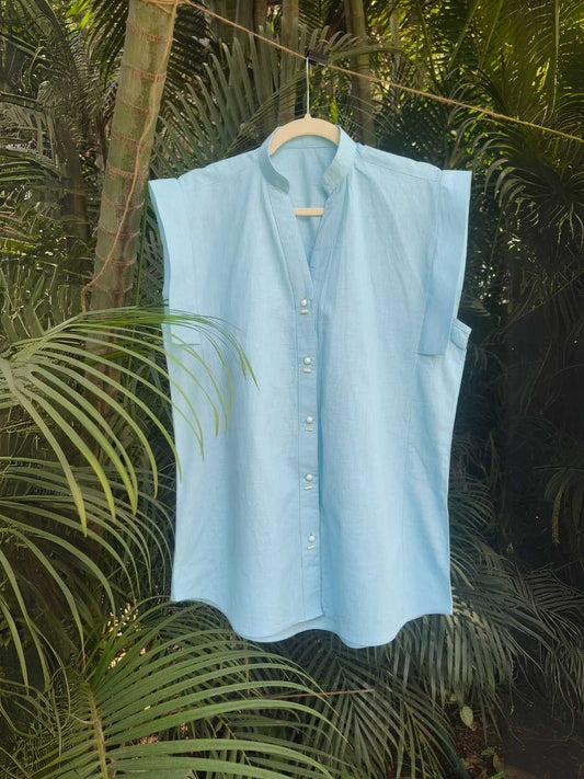 Noa Shirt- Sky Blue Linen Shirt | Jhultaru. 100% Linen- eco-friendly, sustainable, breathable, natural, and timeless, luxury  Shell buttons- biodegradable, and sustainable - A sky blue linen shirt with real shell buttons and cap sleeves, the Noa Shirt by Jhultaru blends effortless comfort with quiet charm.