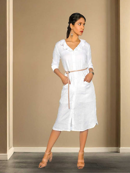 Saira Shirt Dress – A white shirt dress with a clean collar and flared hem, the Saira Dress by Jhultaru is tailored in 100% hemp for structure with softness. Eco-friendly, breathable, and thoughtfully minimalist.