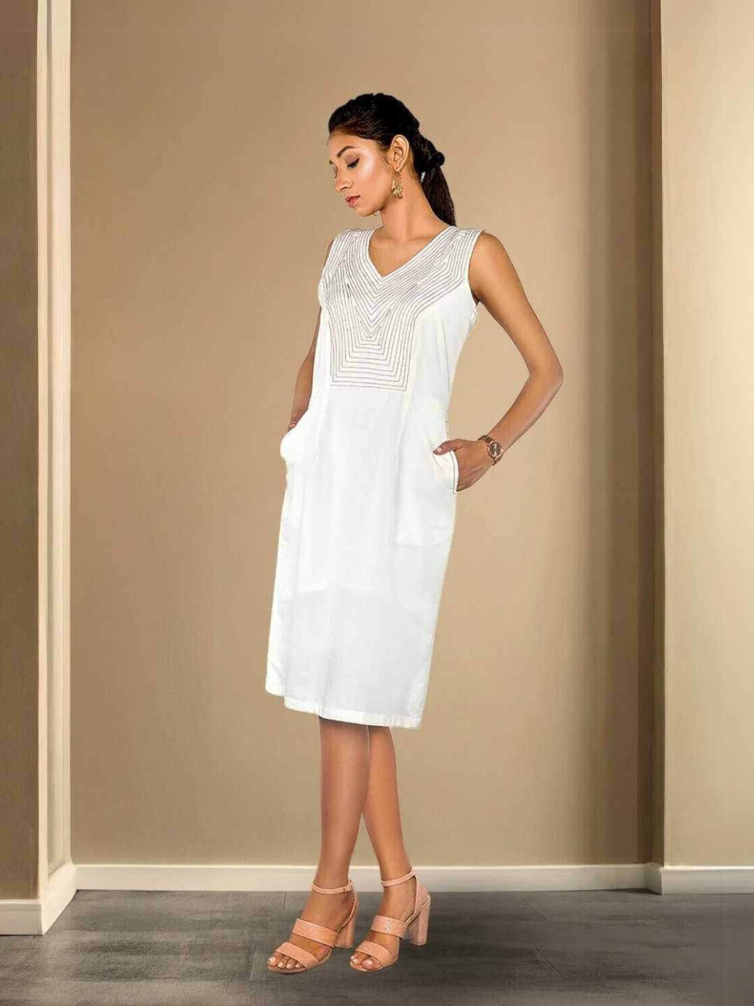 Meira Dress – An embroidered white organic cotton dress, the Meira Dress by Jhultaru evokes softness, serenity, and handcrafted detail. Made with 100% organic cotton – breathable, natural, and timelessly graceful.