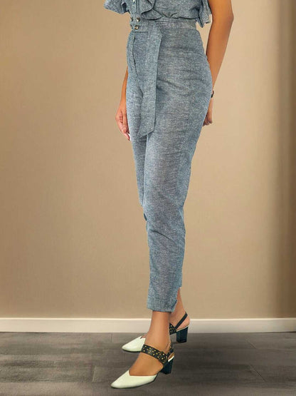Kaia Pants – High-waisted grey hemp trousers with a structured belt and tailored fit, the Kaia Pants by Jhultaru offer timeless silhouette and strength. Made from 100% hemp – eco-friendly, durable, and naturally breathable.
