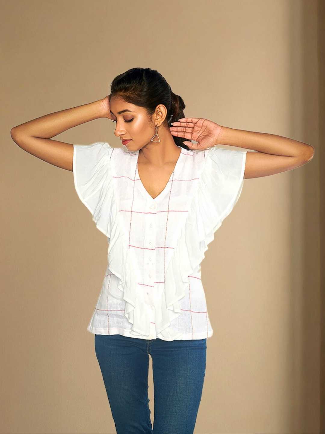 Iyla Top – A white hemp top with soft gathers and a ruffle detail, the Iyla Top by Jhultaru brings a delicate touch to everyday wear. Made from 100% hemp and Tencel – eco-friendly, sustainable, breathable, and timeless. Designed for effortless elegance with a conscious core.