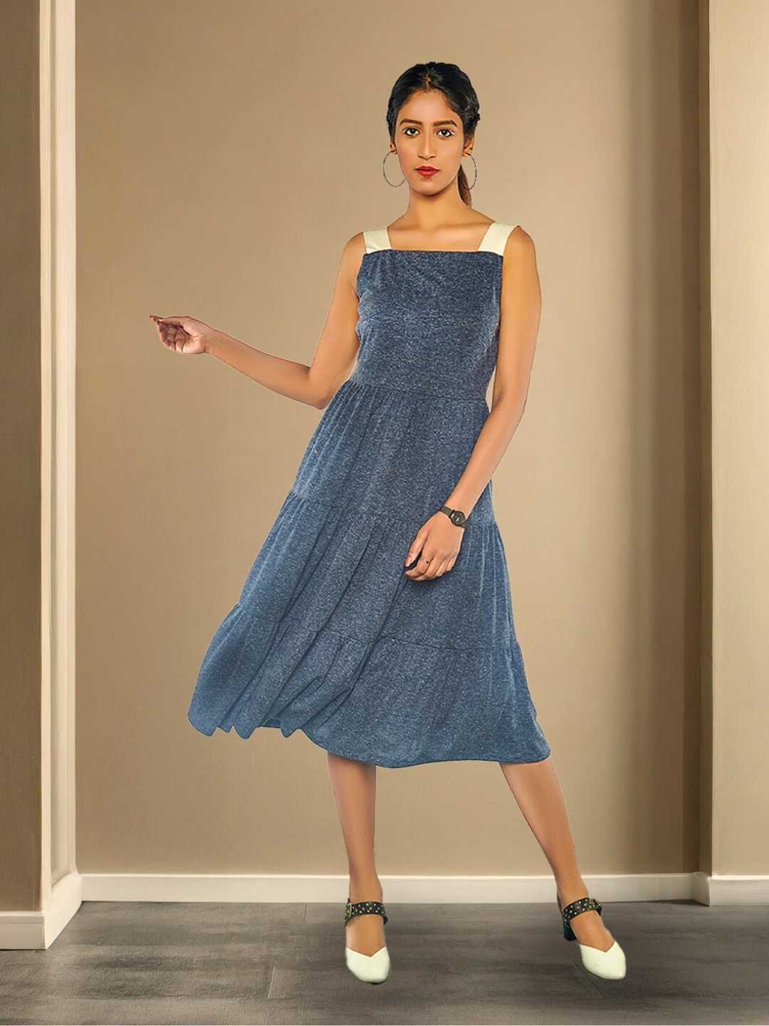 Aeris Dress – A tiered grey midi dress in recycled polyester and hemp, the Aeris Dress by Jhultaru celebrates movement and texture. Crafted with 85% recycled polyester + 15% hemp – eco-conscious, flowy, and wearable all day.